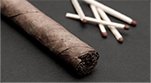 What is the best way to light a cigar?